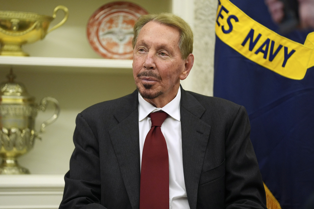 FILE - Larry Ellison, chairman and chief technology officer of Oracle Corporation, sits in the Oval Office of the White House as President Donald Trump signs an executive order, Monday, Feb. 3, 2025, in Washington. (AP Photo/Evan Vucci, File)