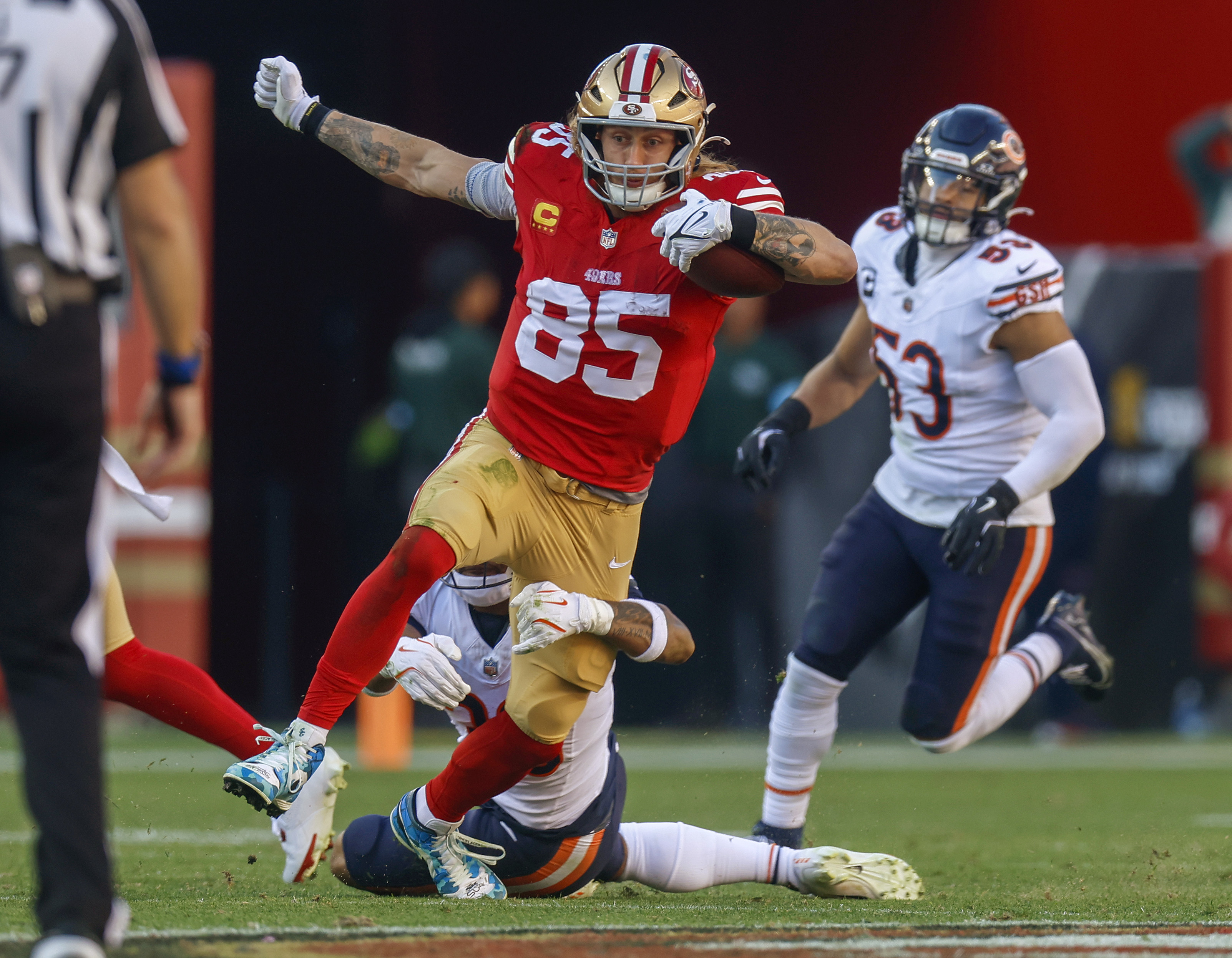 San Francisco 49ers' George Kittle (85) is tackled after a catch by Chicago Bears' Jonathan Owens (36) in the second quarter at Levi's Stadium in Santa Clara, Calif., on Sunday, Dec. 8, 2024. (Nhat V. Meyer/Bay Area News Group)