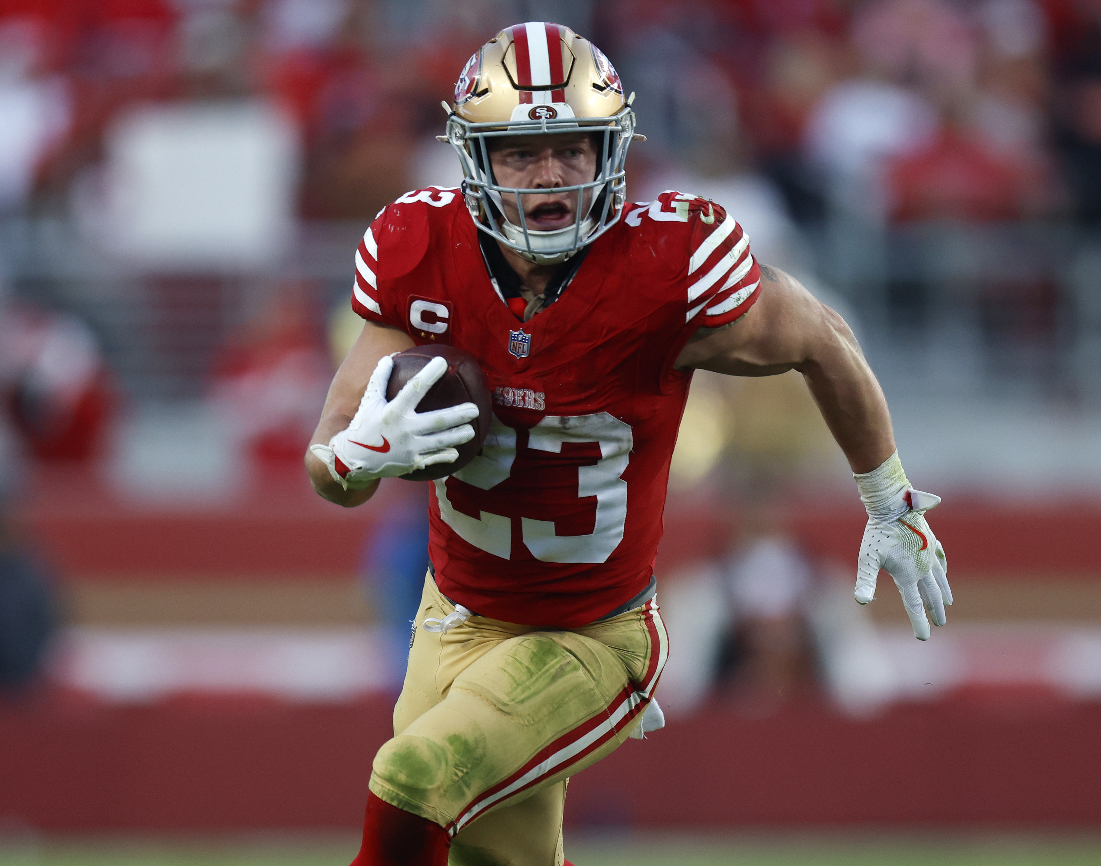 San Francisco 49ers’ Christian McCaffrey (23) runs against the Tennessee Titans in the fourth quarter at Levi's Stadium in Santa Clara, Calif., on Sunday, Dec. 14, 2025. (Nhat V. Meyer/Bay Area News Group)