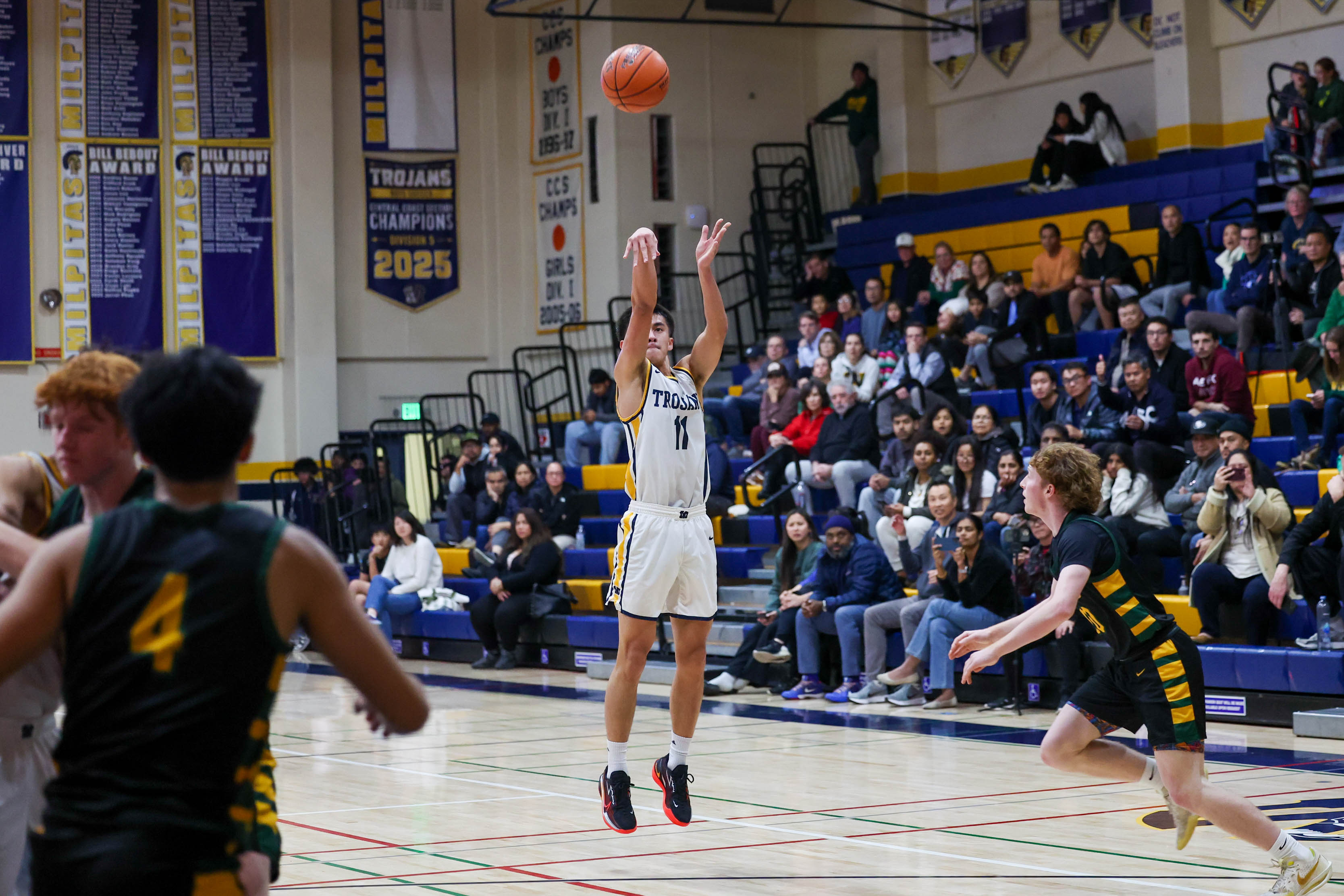 Milpitas’ Dylan Nguyen (11) lays up a shot against San Ramon Valley High during a nonleague boys basketball game at Milpitas High School in Milpitas, Calif., on Thursday, Nov. 18, 2025. (Ray Chavez/Bay Area News Group)