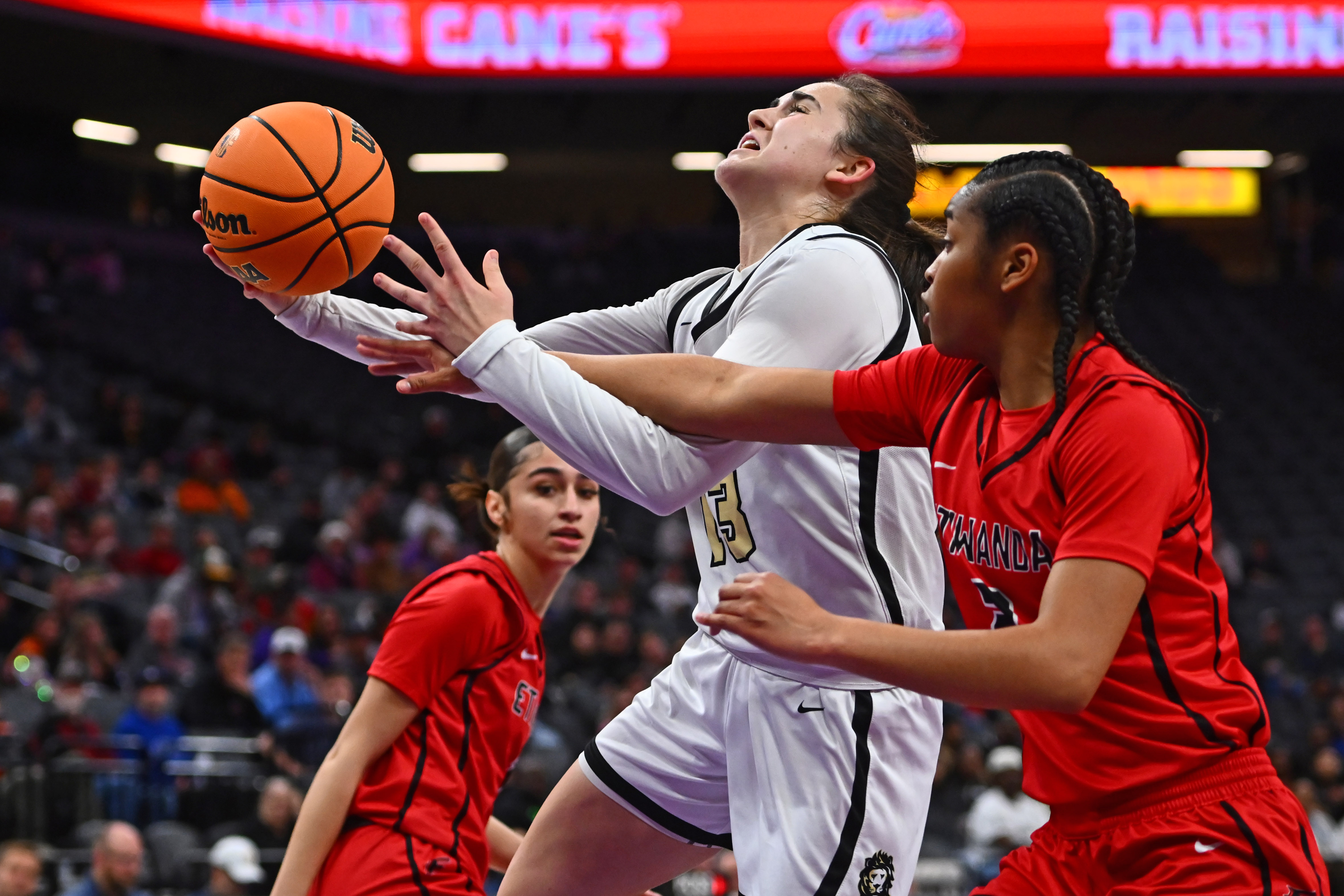 Archbishop Mitty's Emma Cook (13) gets fouled by Etiwanda's Arynn Finley (2) in the first half of their 2025 CIF State Basketball Championship Open Division girls game at Golden 1 Center in Sacramento, Calif., on Saturday, March 15, 2025. (Jose Carlos Fajardo/Bay Area News Group)