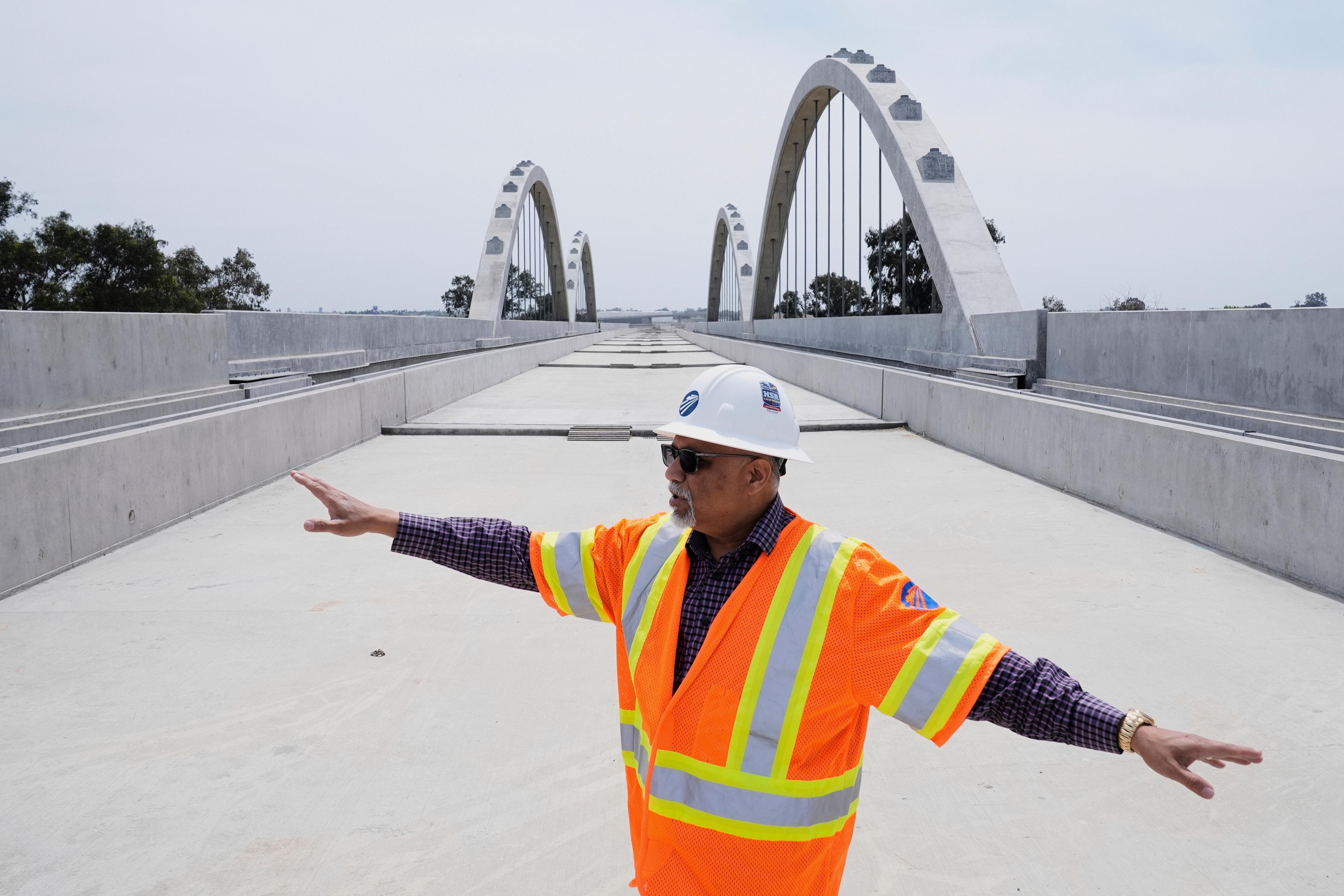  Garth Fernandez, Central Valley regional director for the California High-Speed Rail Authority, talks about the Cedar Viaduct in Fresno, Calif., April 15, 2025. (AP Photo/Godofredo A. Vásquez, File)
