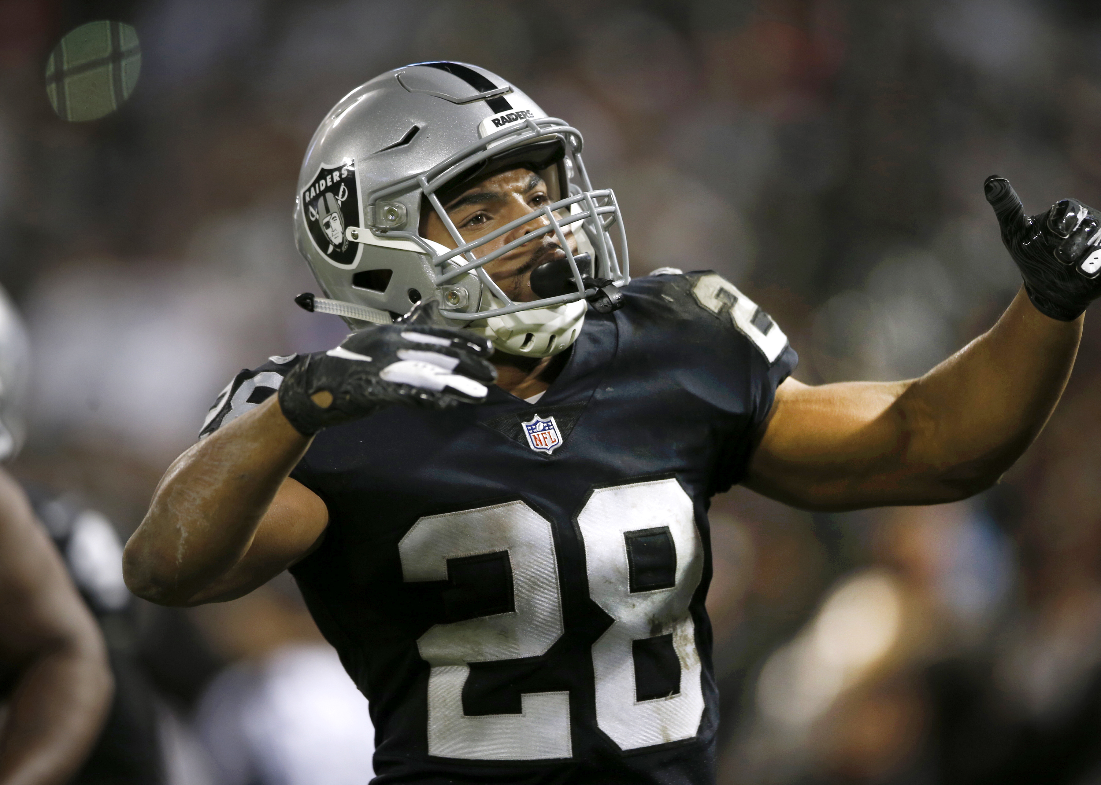Oakland Raider running back Doug Martin (28) scores a 2nd quarter touchdown against the Denver Broncos at the Oakland Coliseum, Monday, Dec. 24, 2018. (Karl Mondon/Bay Area News Group)