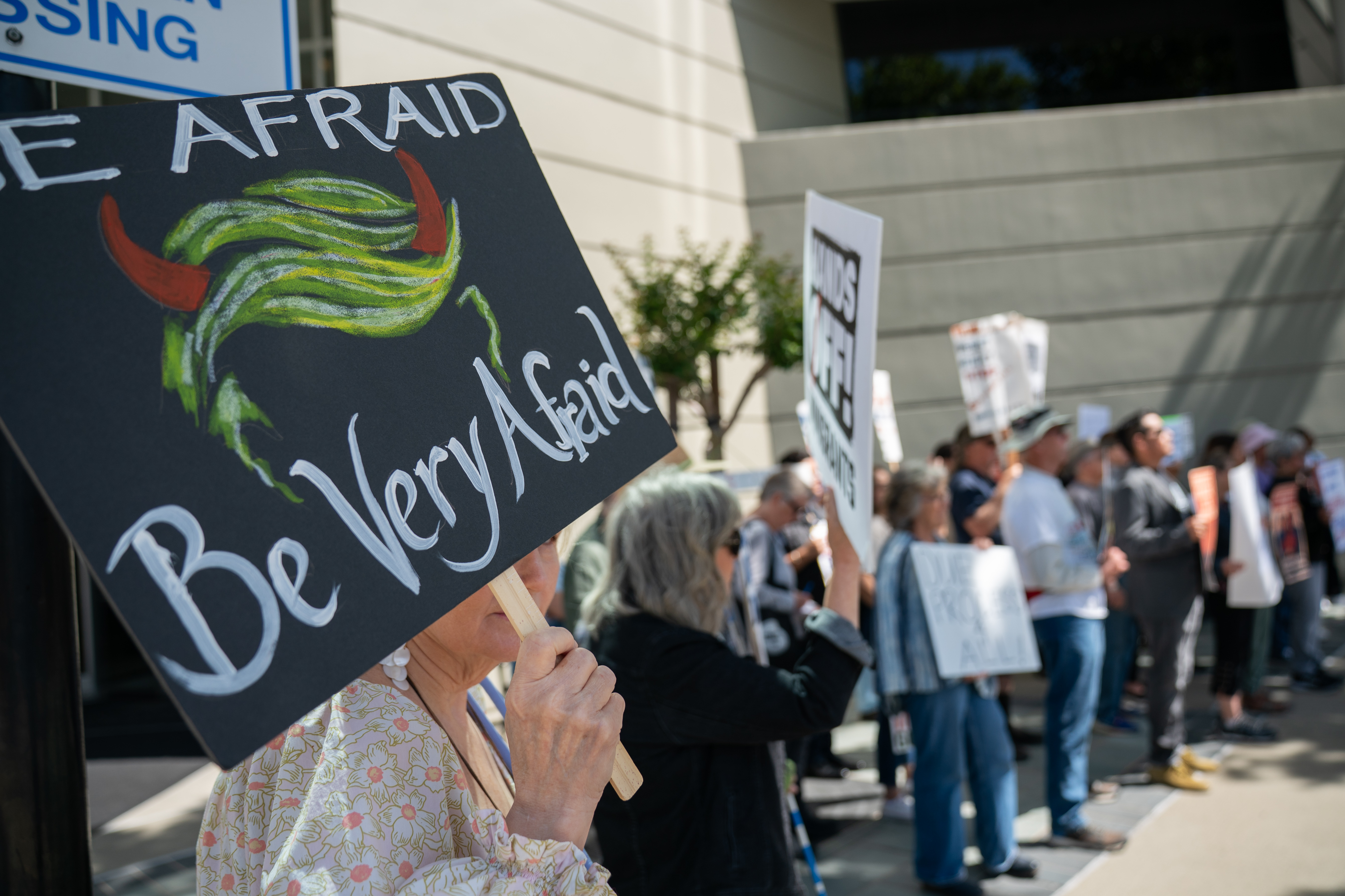 Protestors gather outside the Concord Immigration Court during an anti-Trump deportation and immigration policy in Concord, CA, on Thursday, May 15, 2025. Immigrant rights advocates, legal counsel, and community members gathered outside the court to outline Trump policy details which use fearmongering, lack of due process, and misinformation tactics to deport migrants from other countries.  (Don Feria for Bay Area News Group)