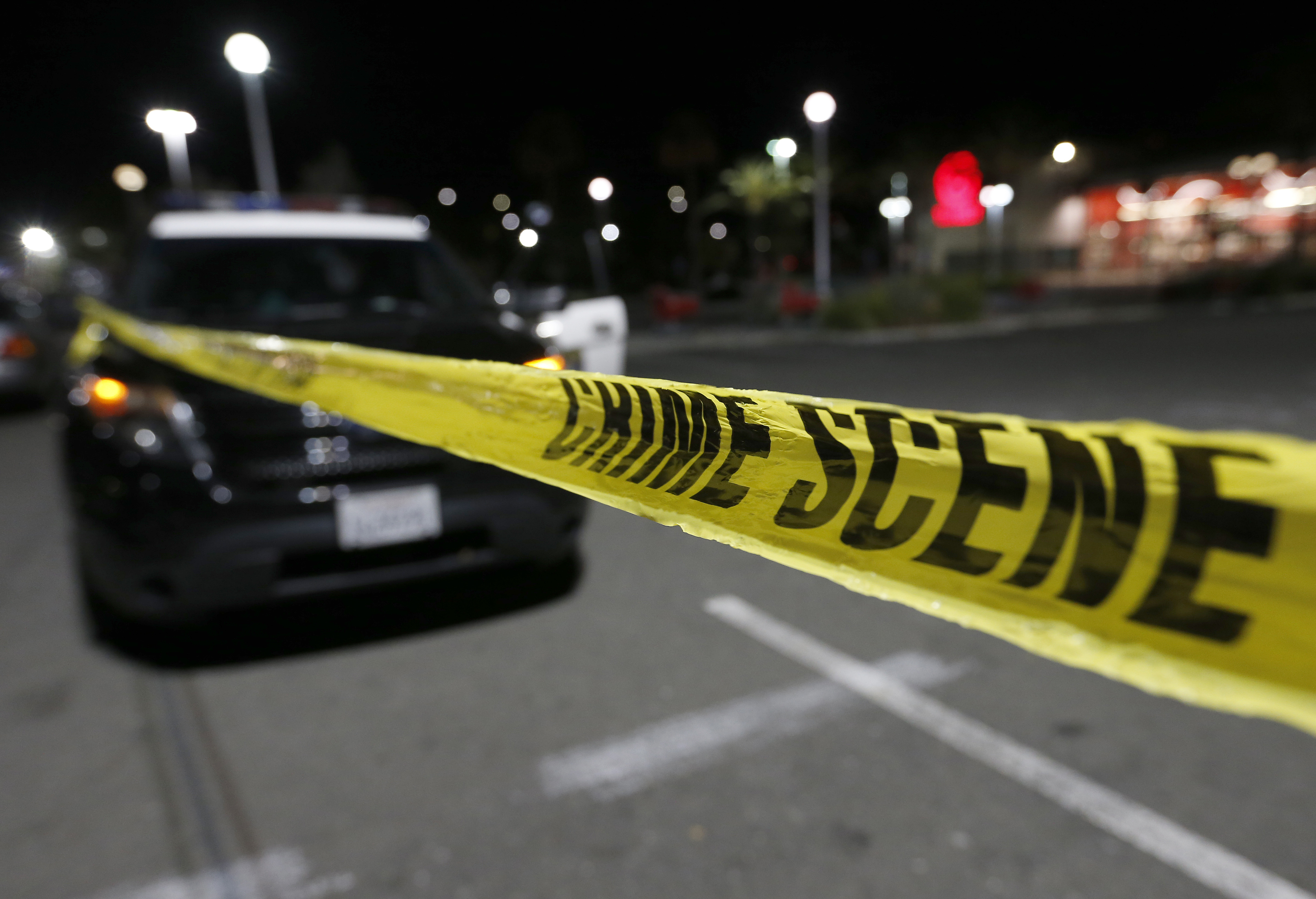 Oakland and Emeryville police investigate the scene of a shooting after a fist-fight turned violent in the Target store parking lot in Emeryville, Calif., on Monday, Dec. 4, 2017. Two gunshot victims were taken to a local hospital, where at least one was in critical condition, and one suspect was detained according police. (Jane Tyska/Bay Area News Group)

