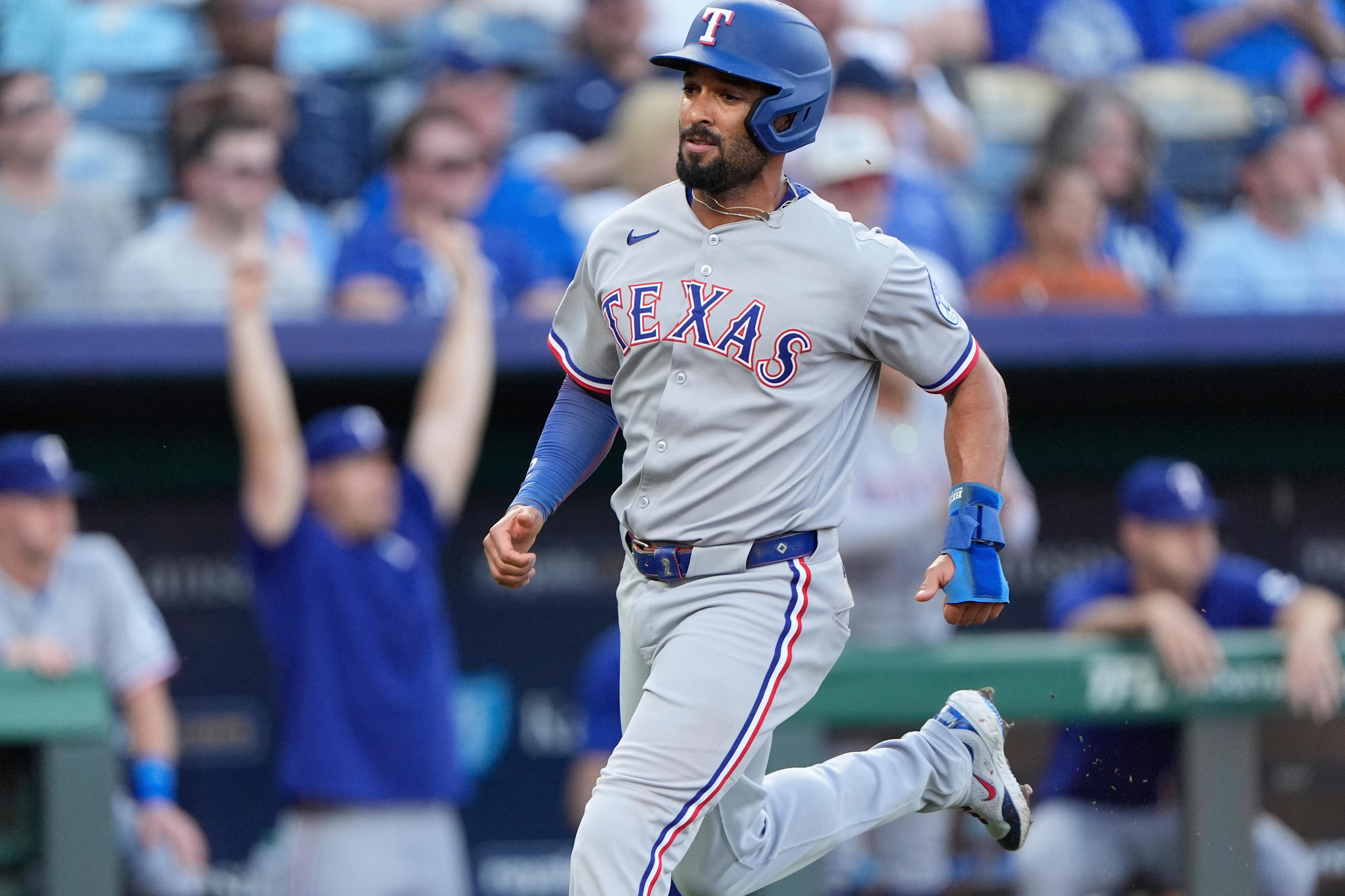 FILE – Texas Rangers’ Marcus Semien runs home to score on an RBI single hit by Jonah Heim during the second inning of a baseball game against the Kansas City Royals, Monday, Aug. 18, 2025, in Kansas City, Mo. (AP Photo/Charlie Riedel, File)
