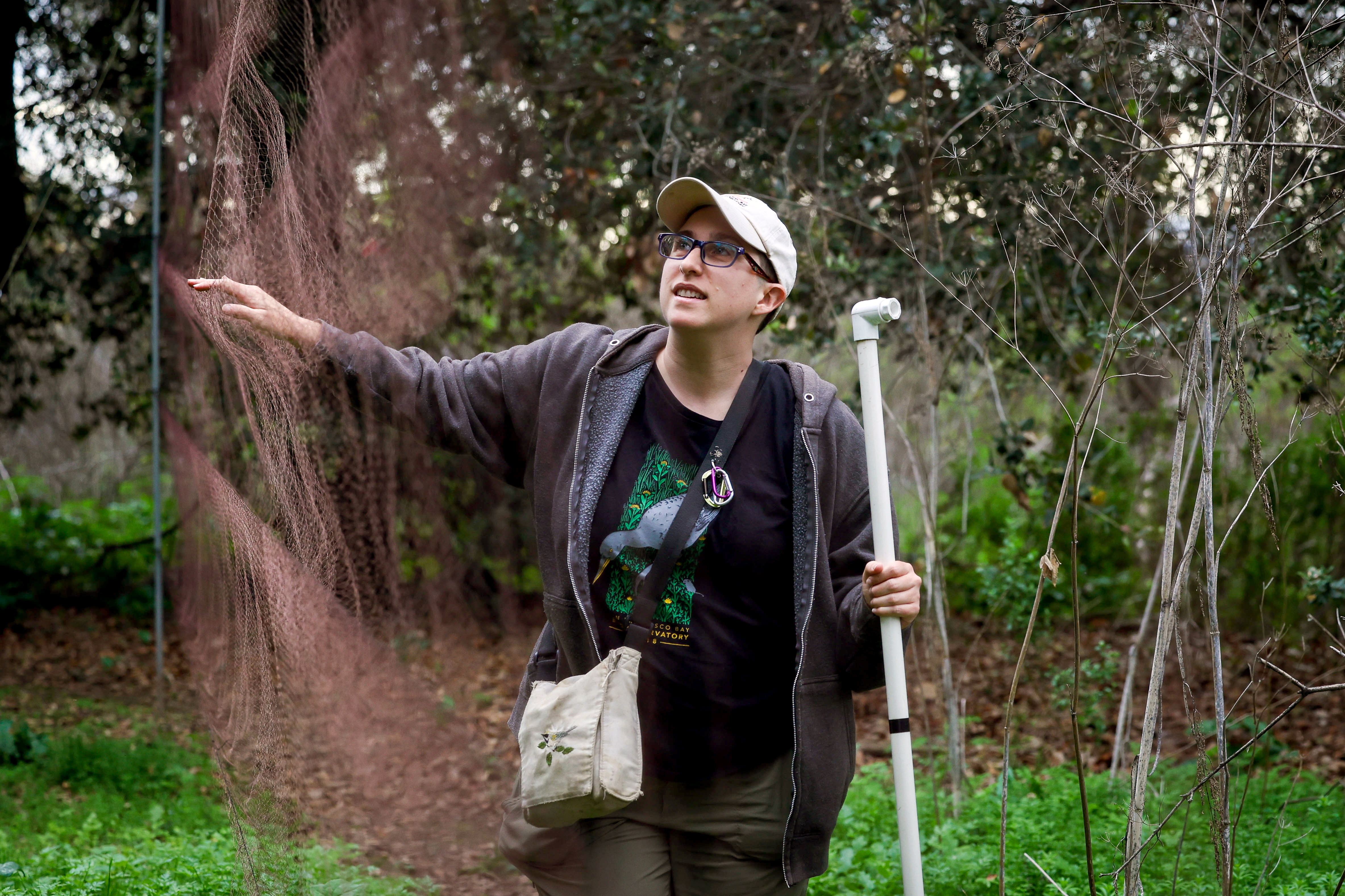 San Francisco Bay Bird Observatory Science Director Katie LaBarbera checks a mist net used to capture birds for banding before releasing them back into their natural habitat at the Coyote Creek Field Station in Milpitas, Calif., on Saturday, Dec. 20, 2025. (Ray Chavez/Bay Area News Group)